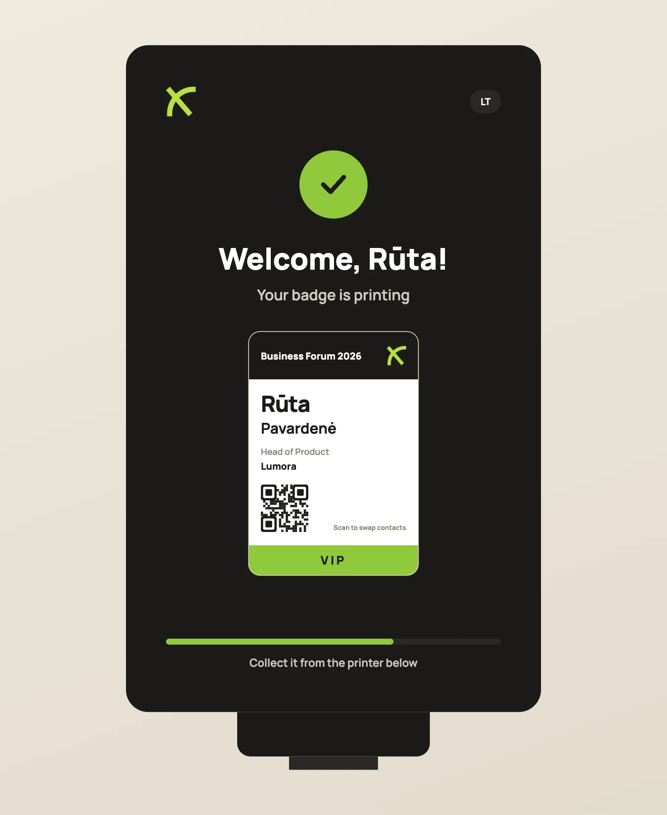 VeloxEntry kiosk after scanning: the name badge is printing